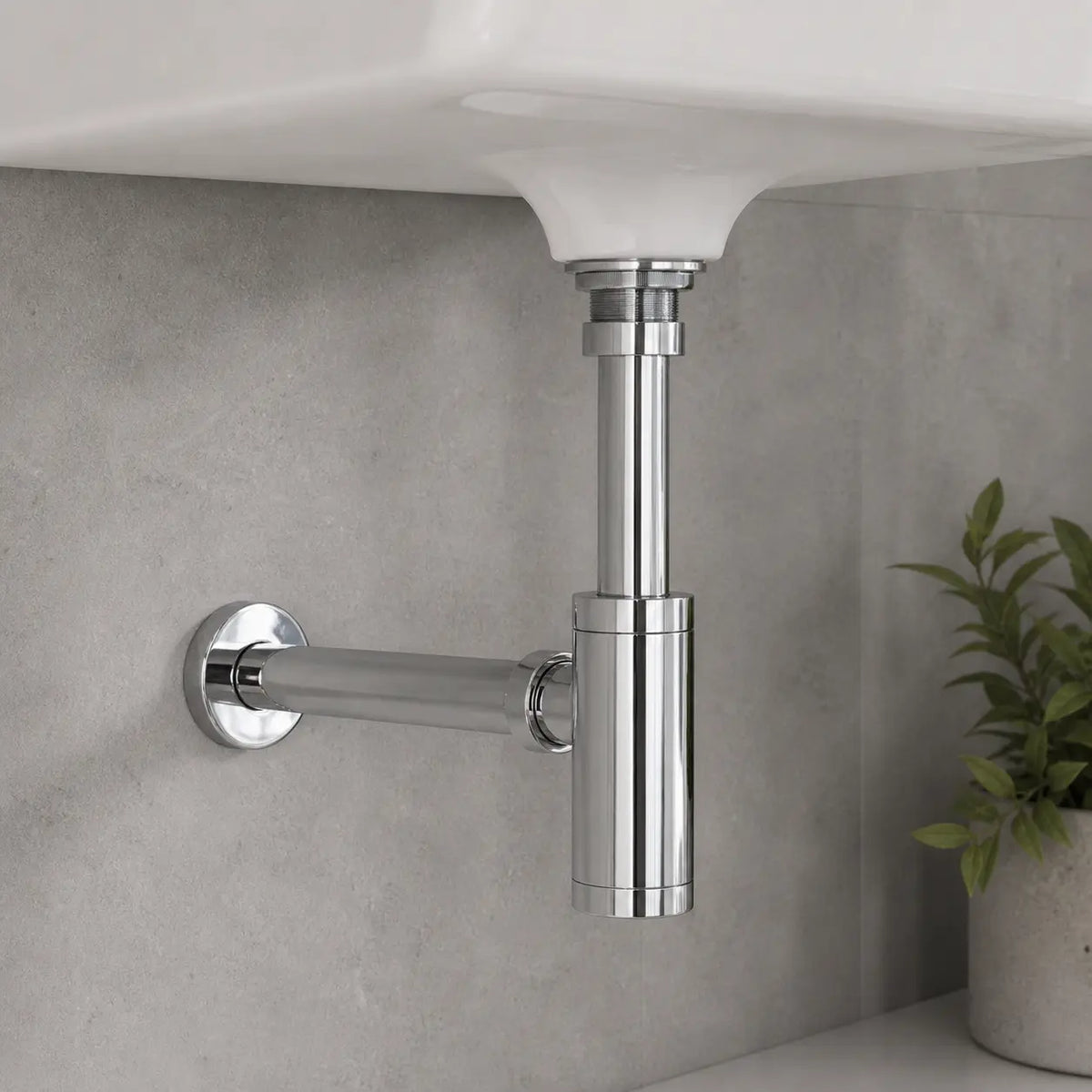 Siphon lavabo chrome fixé dans un lavabo blanc